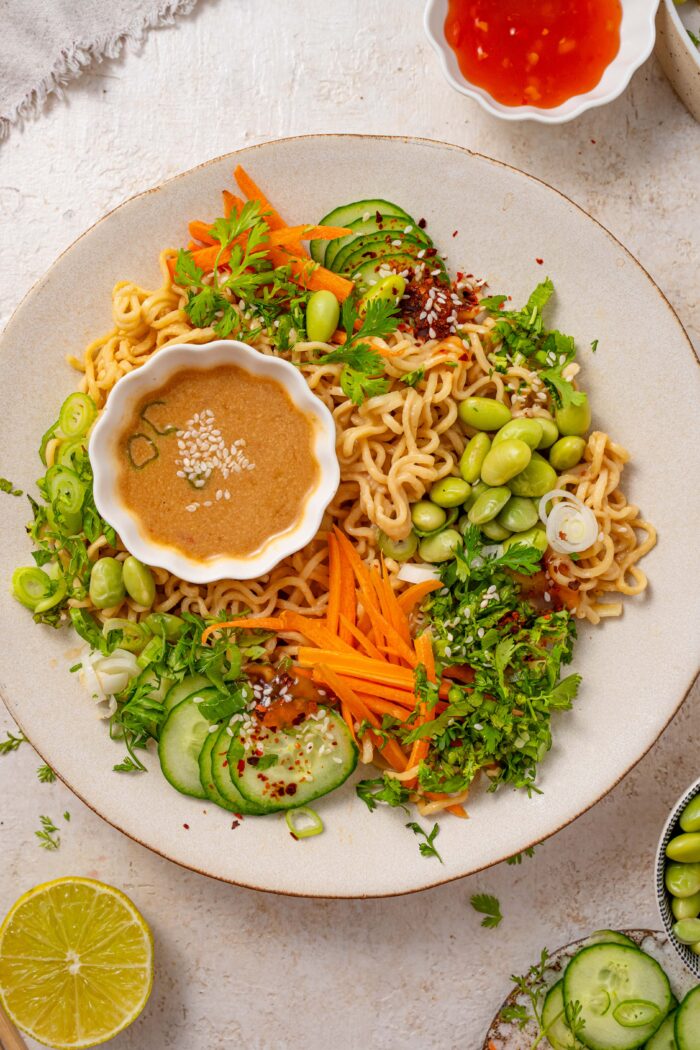 cold sesame noodles served with fresh toppings and extra sauce