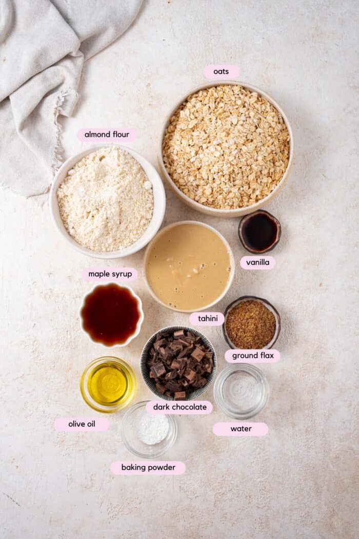 Ingredients for vegan oatmeal cookies on a white back drop