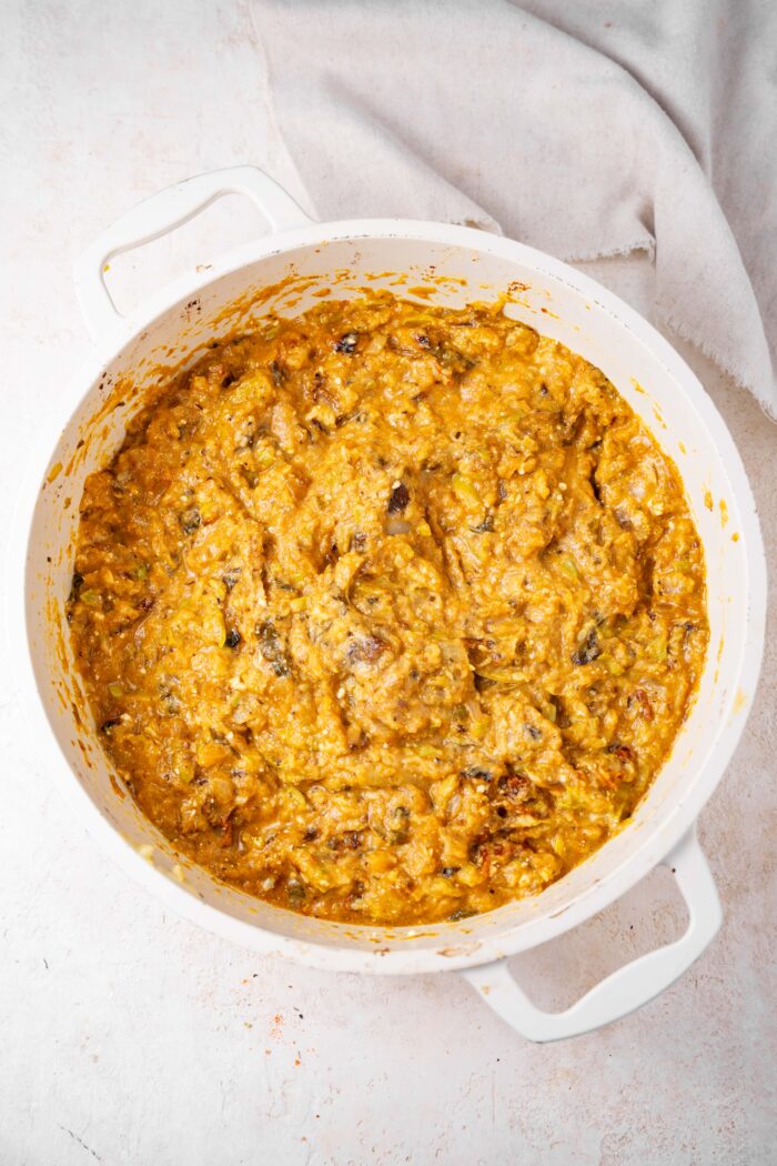 Zucchini lemon pasta sauce mixed together in the casserole dish.