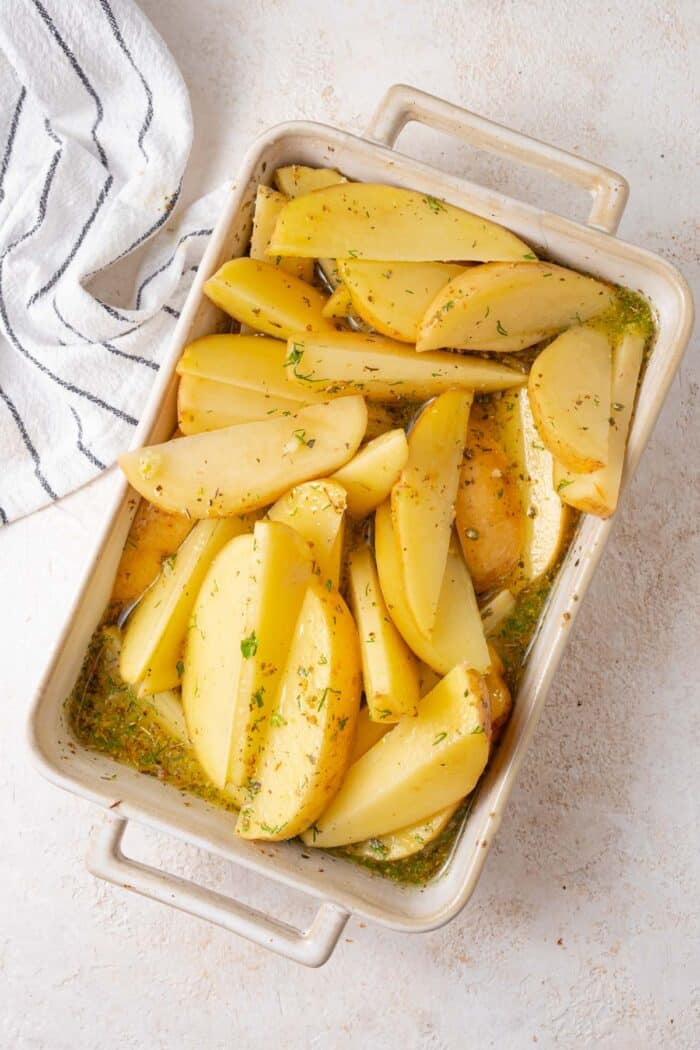 Yukon gold potato wedges mixed with the broth and herb mixture.