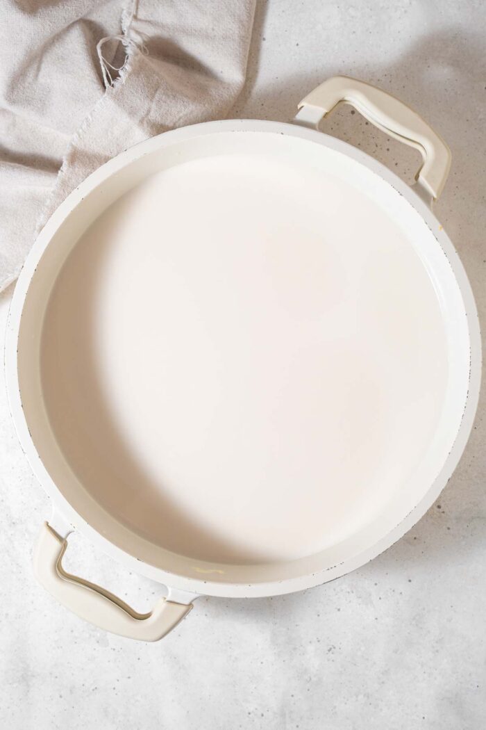 Soy milk in a white crockpot.