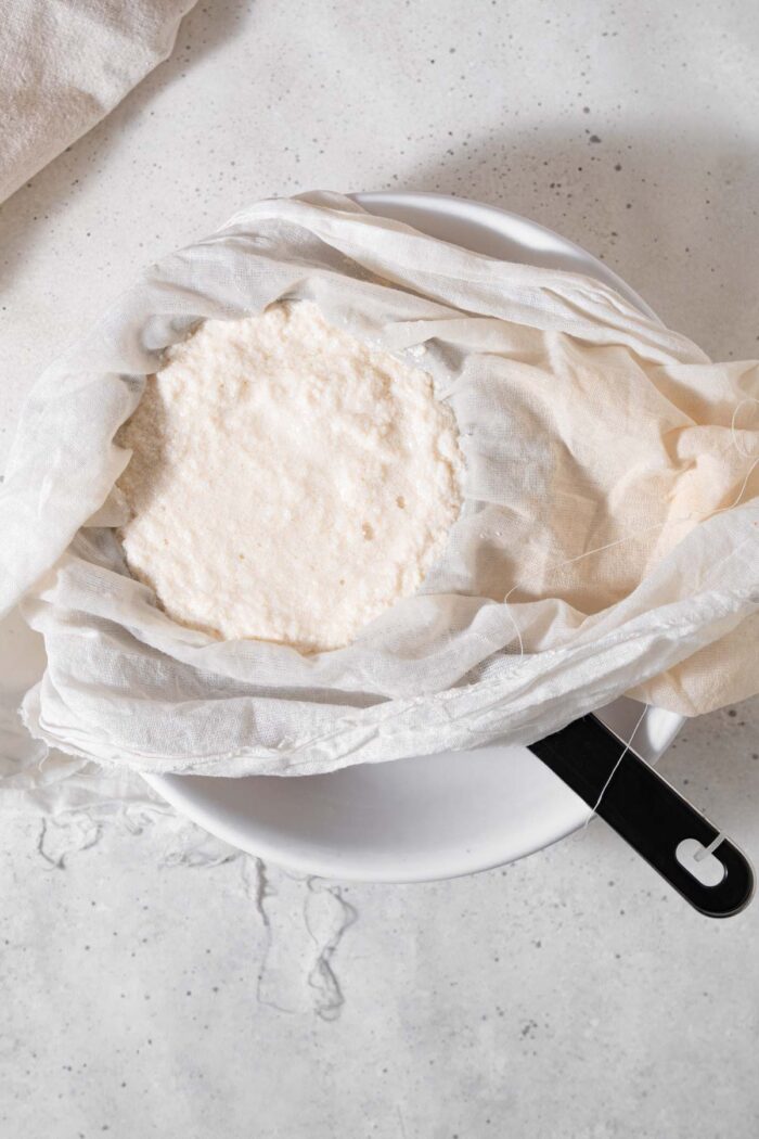 Soy curds strained through cheesecloth.
