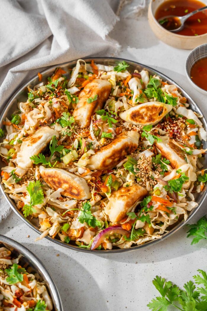 Vegan dumpling salad served in a dish.