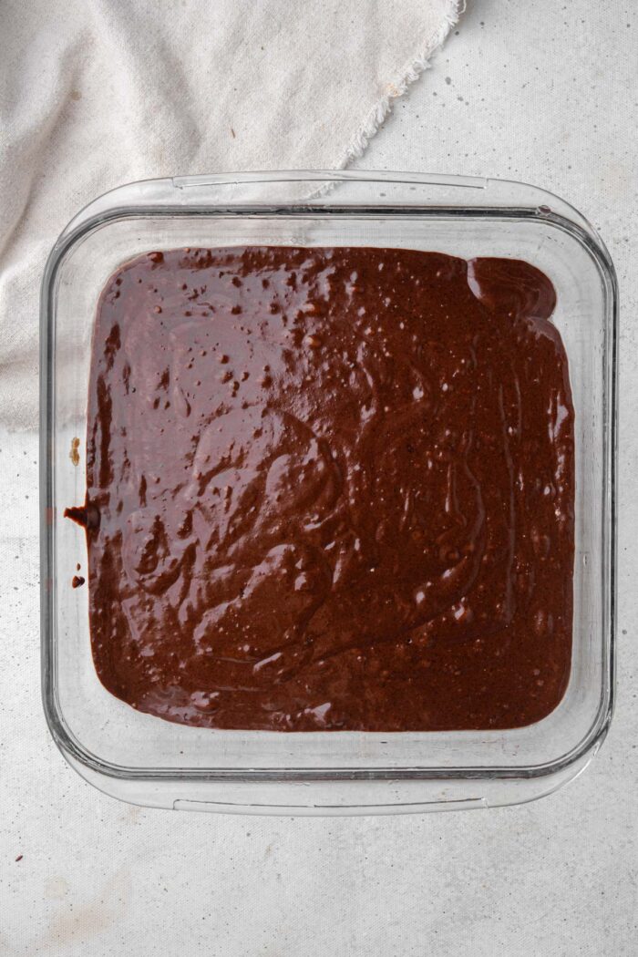 Pudding cake batter in the 9-inch cake pan.