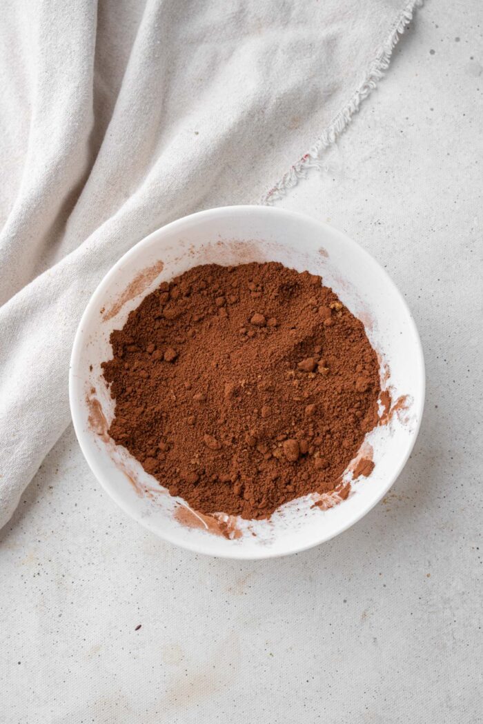 Cocoa and brown sugar mixed together in a small bowl.