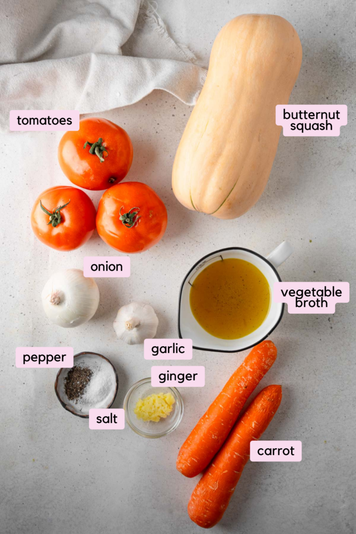 Butternut squash carrot soup ingredients laid out and labeled.