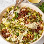 Criapy rice salad served with the dressing drizzled over the top.