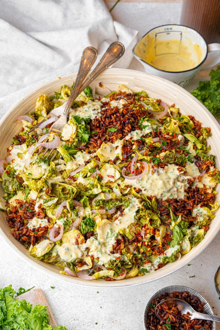 Criapy rice salad served with the dressing drizzled over the top.