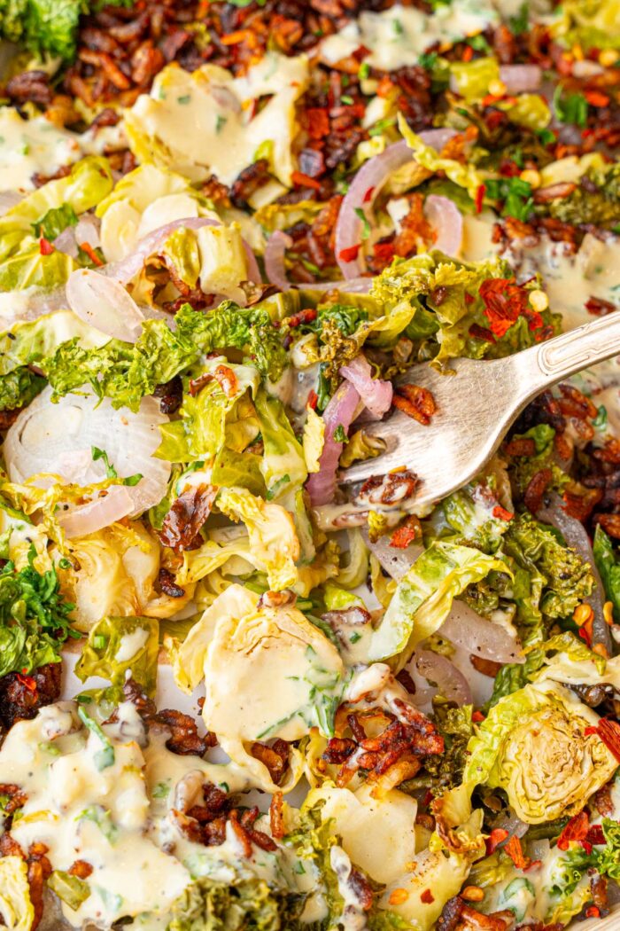 Close up of crispy rice salad with a fork.