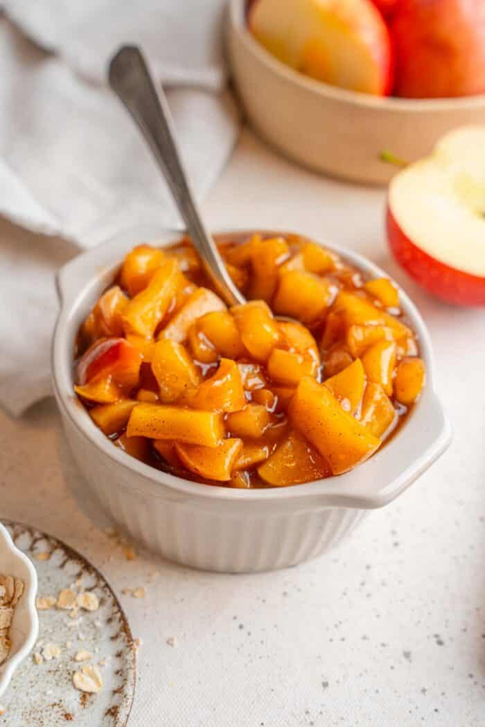 Stewed apples in a ceramic ramekin.