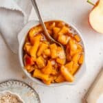 Title image for healthy stewed apples in a bowl.
