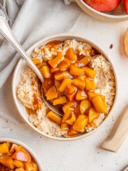 Healthy stewed apples served on top of oatmeal.