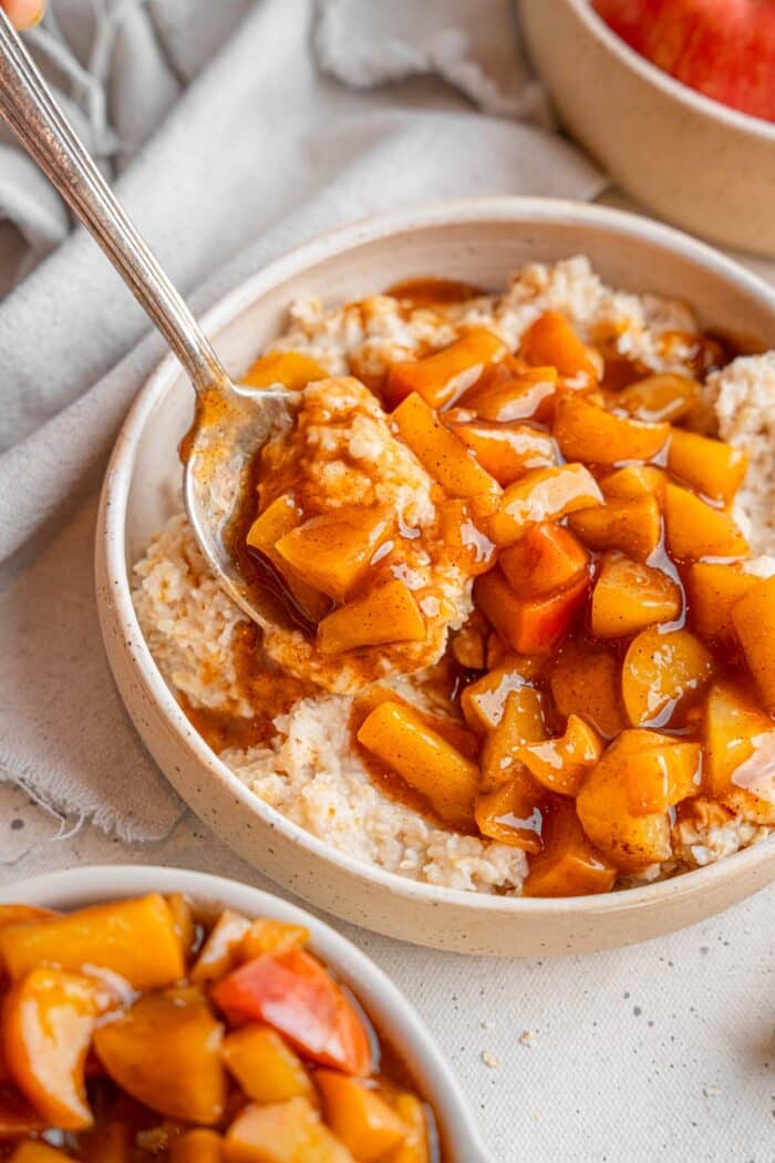 Healthy stewed apples served over oatmeal.