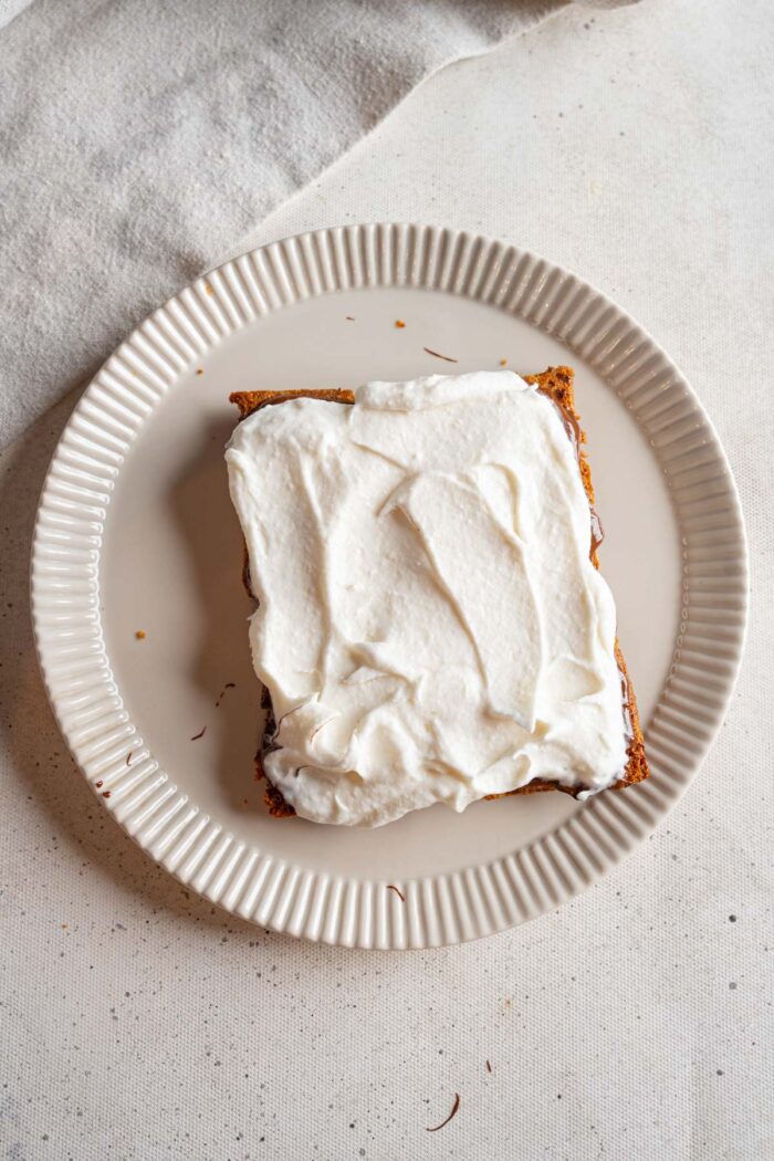 Cocowhip spread on top of chocolate and graham crackers.