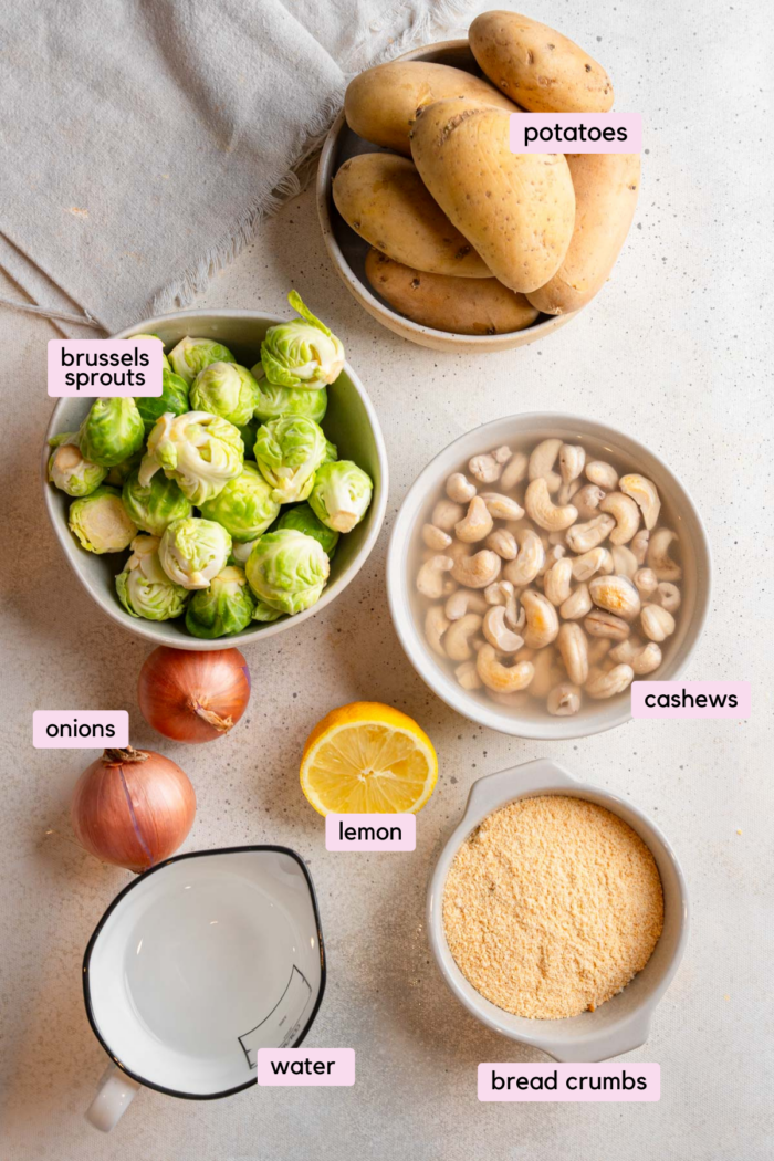 Rumbledethumps ingredients, including Brussels sprouts, potatoes cashews, and seasonings.