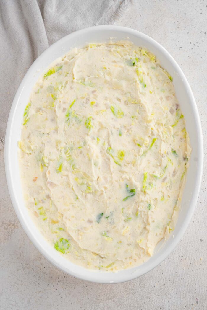 Rumbledethumps mixture spread flat in the casserole dish.