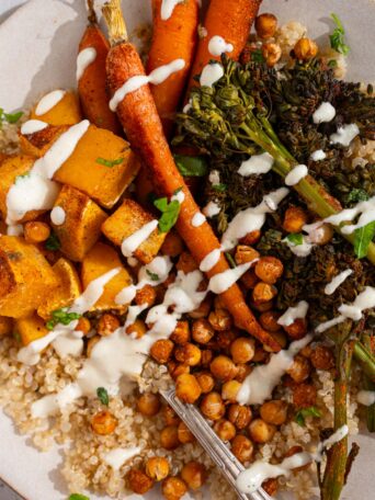 Vegan ranch dressing drizzled over the quinoa sweet potato bowl.