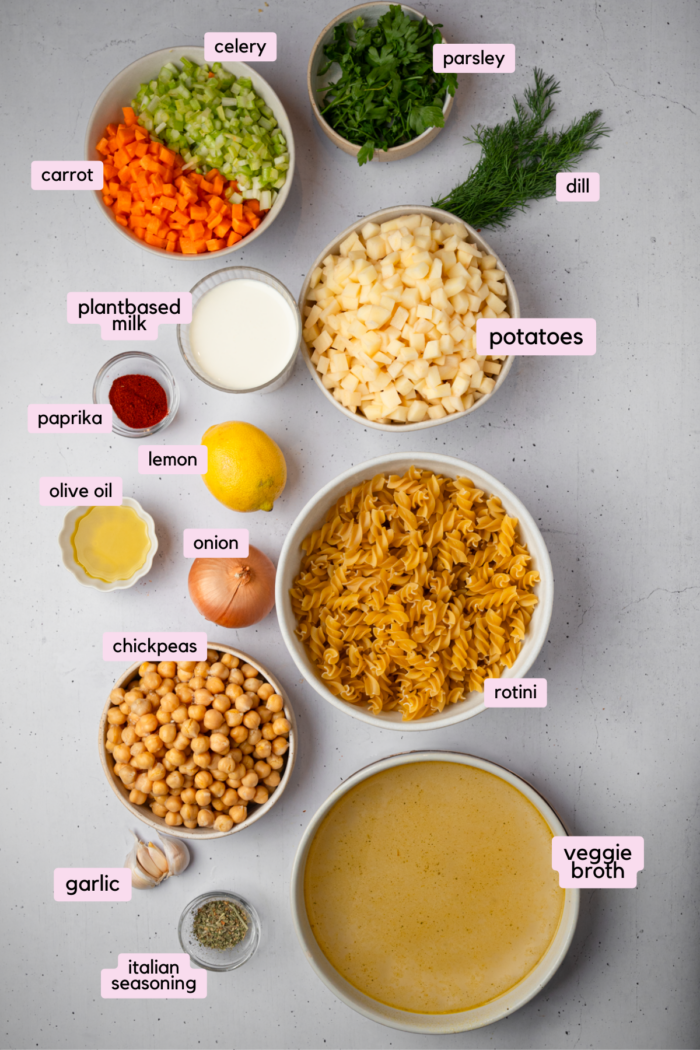 Ingredients for the creamy vegetable soup laid out and labeled on a white background.