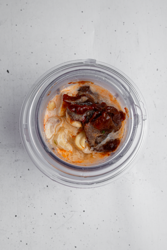 Chipotle sauce ingredients in a blender cup.