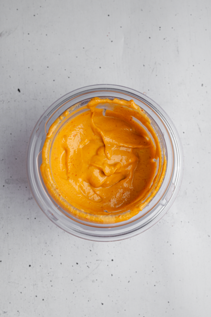Vegan chipotle dressing in a blender cup.