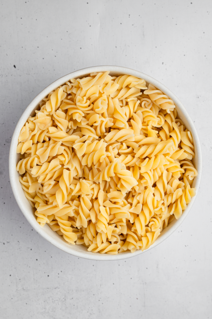 Cooked rotini noodles in a bowl.