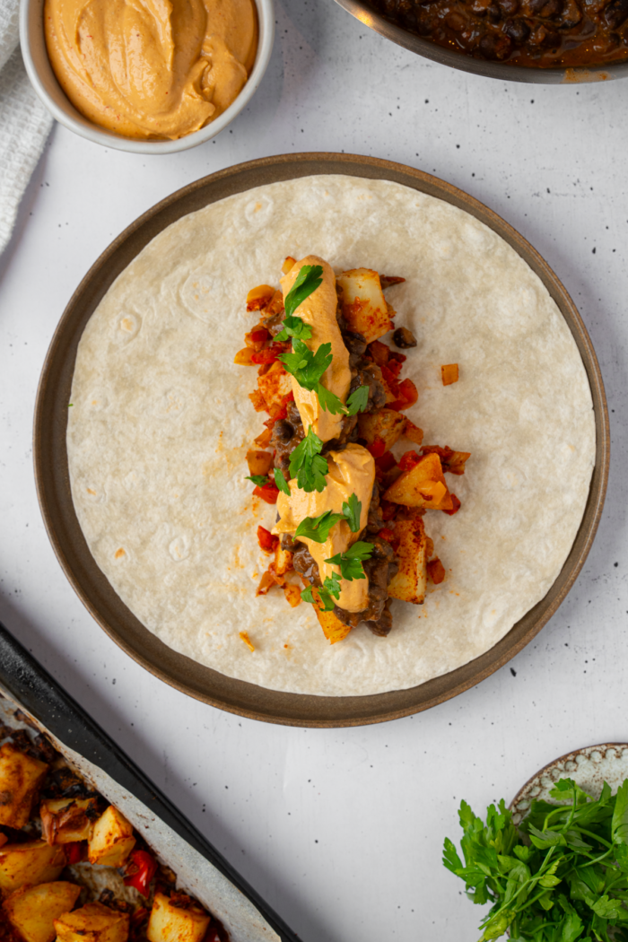 Black bean burritos assembled just before wrapping.