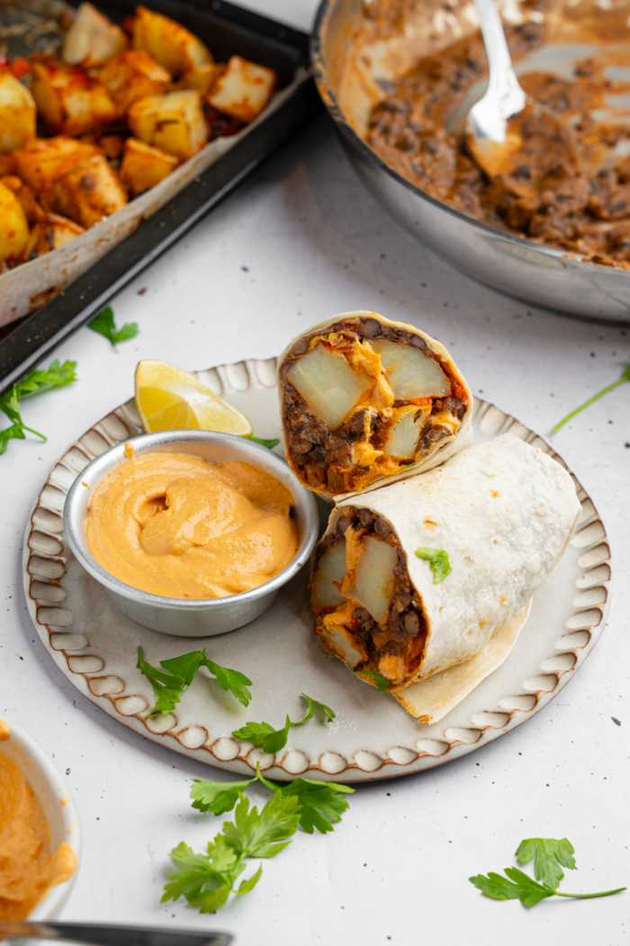 Vegan black bean burritos served with chipotle dipping sauce.