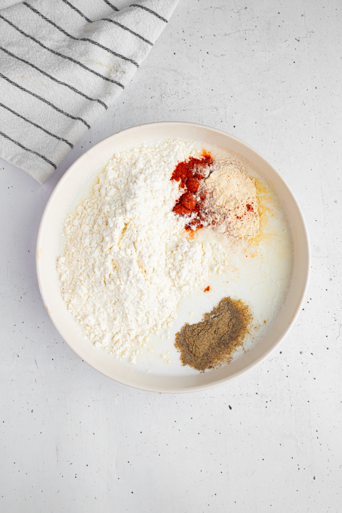 Flour and spices added to vegan buttermilk.