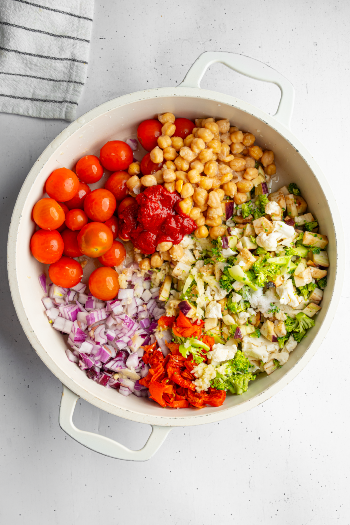 Vegetable components in a oven-safe casserole dish.