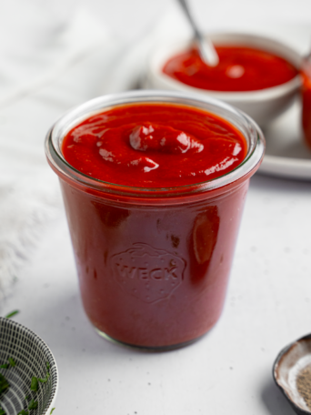 Homemade ketchup in a jar.