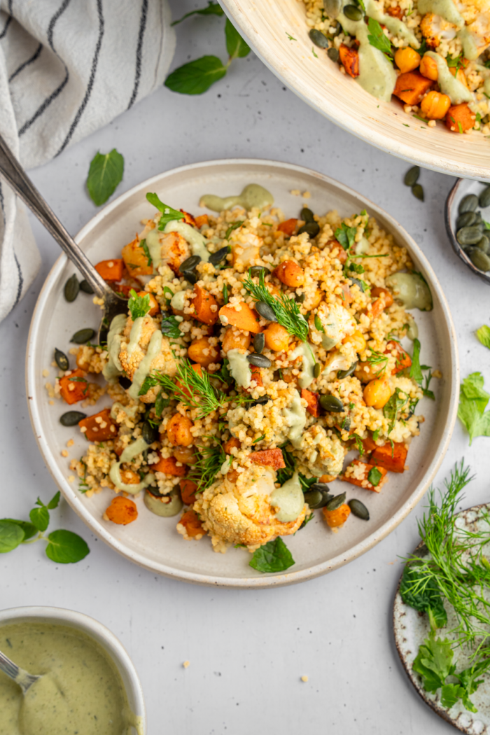 Cauliflower sweet potato couscous salad title image.