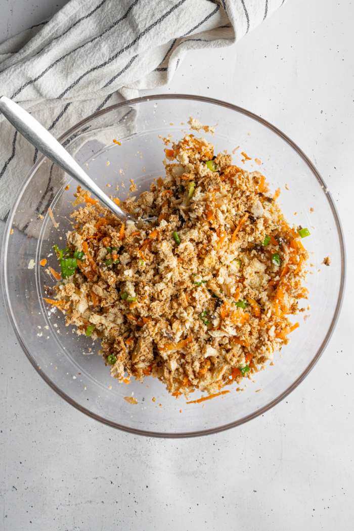 The filling for cabbage rolls mixed together in a glass bowl.