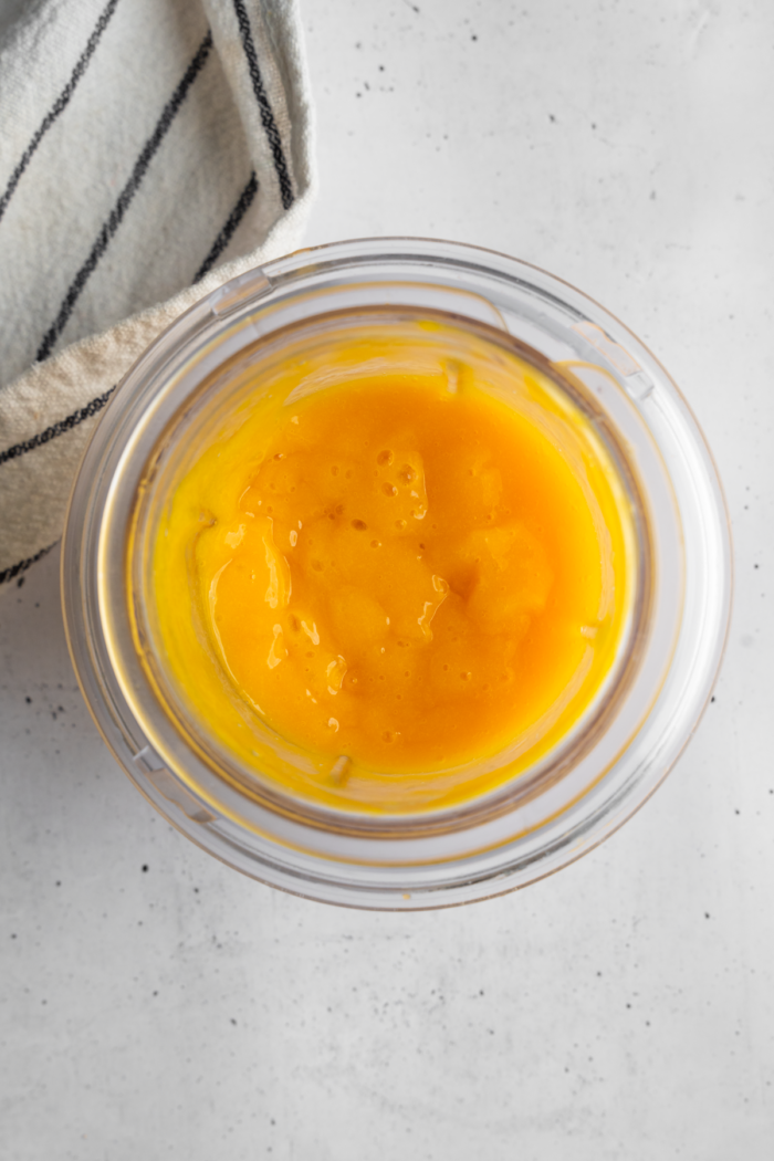Blended mango puree in a bowl.