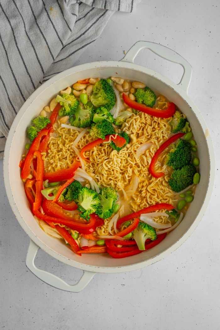 After noodles absorbed liquids, the mixture fills the pan.