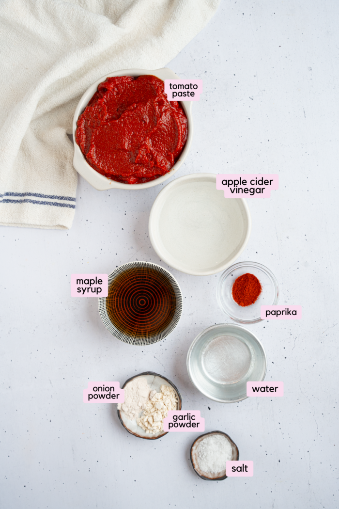 Ingredients for the homemade ketchup laid out and labeled on a white background