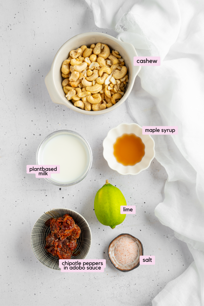 Ingredients for vegan chipotle mayo laid out and labeled on a white background.