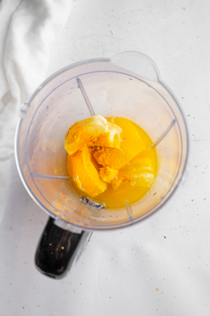 Oranges. lemons, ginger, and seasonings together in a high-speed blender.
