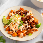Front view of the bowl featuring sweet potatoes, chickpeas, and vegan coleslaw.