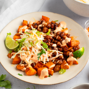 Front view of the bowl featuring sweet potatoes, chickpeas, and vegan coleslaw.