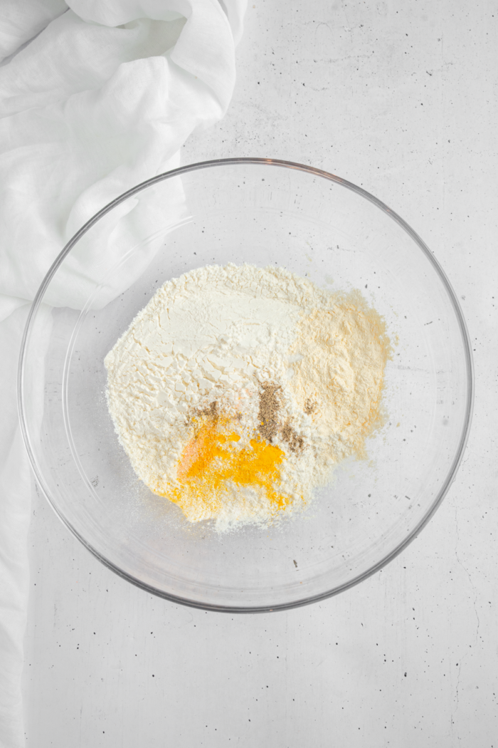 Dry ingredients, including all purpose flour, chickpea flour, turmeric, salt, pepper, and baking powder.