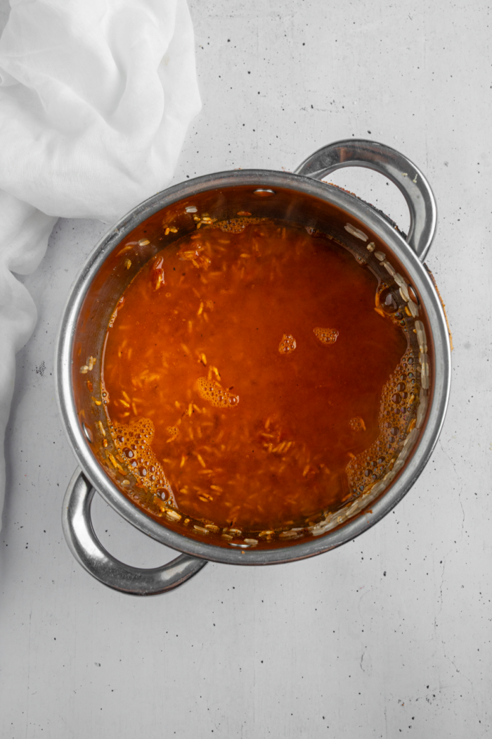 Vegetable broth added to the rice to cook.