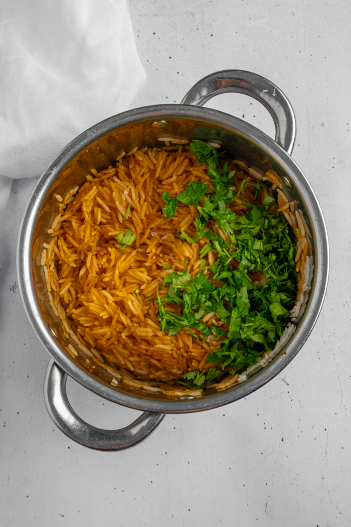 Fluffy spiced Mexican rice with cilantro and lime juice.