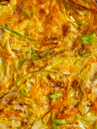 Close up shot of the vegetable pancake showing the vegetables.