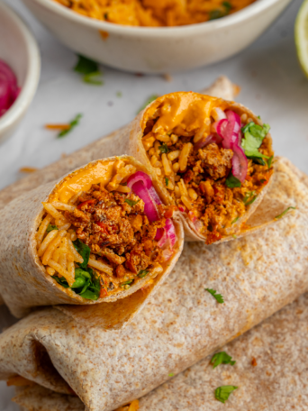 Meal prep burritos cut in half.