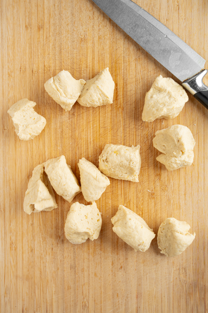 Donut dough cut into equal chunks.