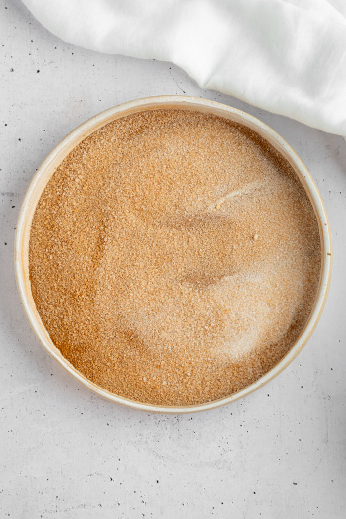 Cinnamon and sugar mixed together to create a coating for banana donut holes.
