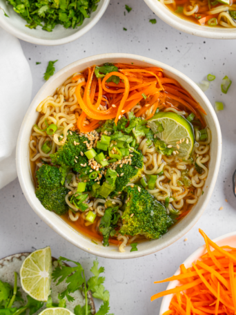 Spring noodle soup served in a large ramen bowl.