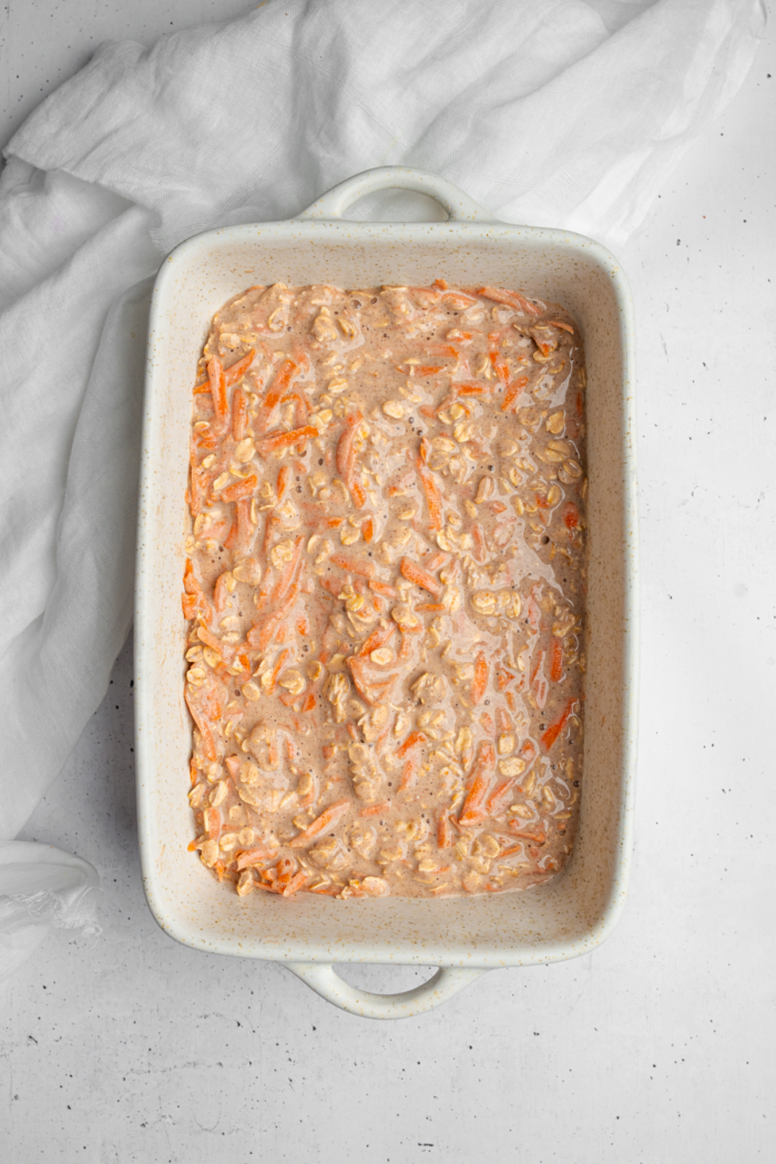 The carrot cake oatmeal mixture in the baking dish.