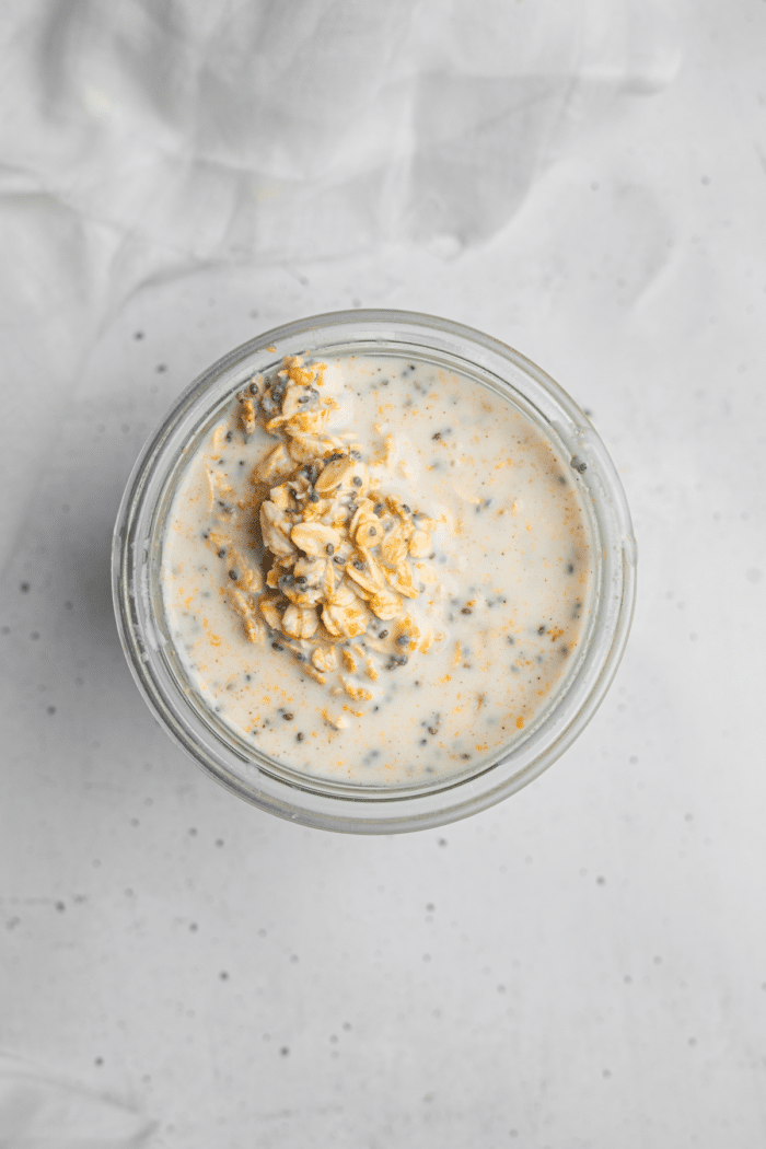 Oat mixture transferred to a glass jar to set in the fridge.