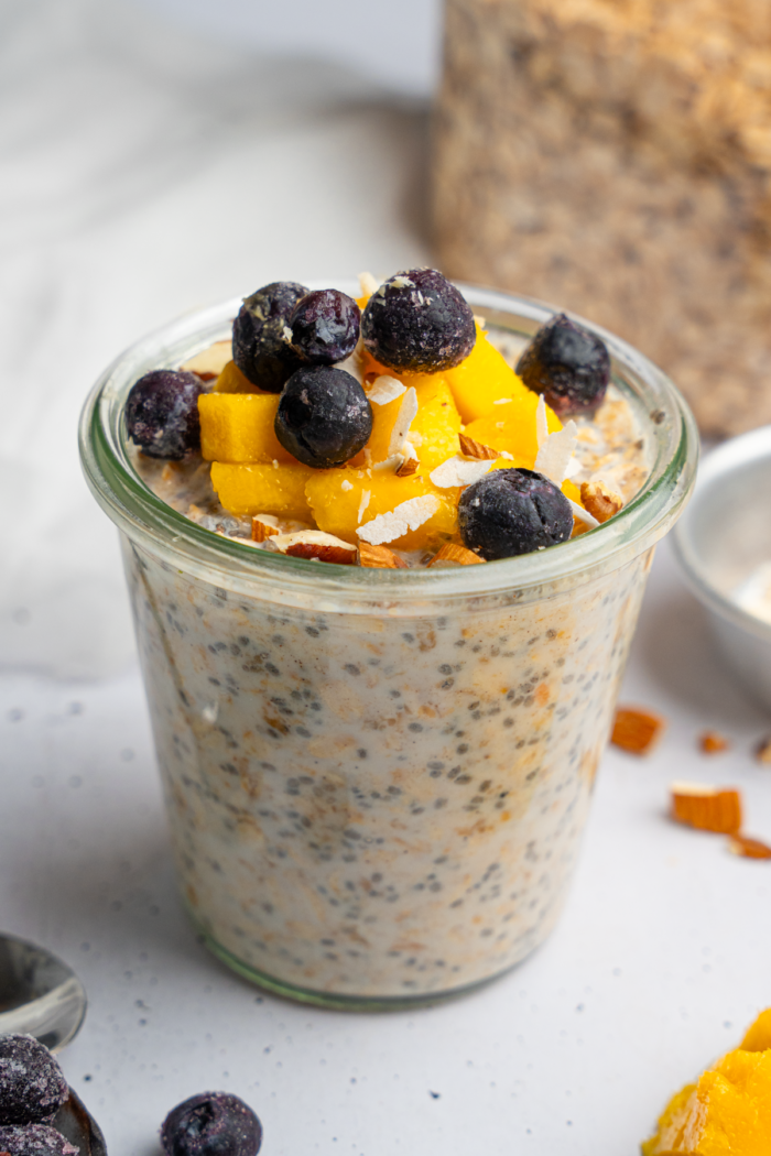 Delicious high protein overnight oats with fresh fruits as toppings.